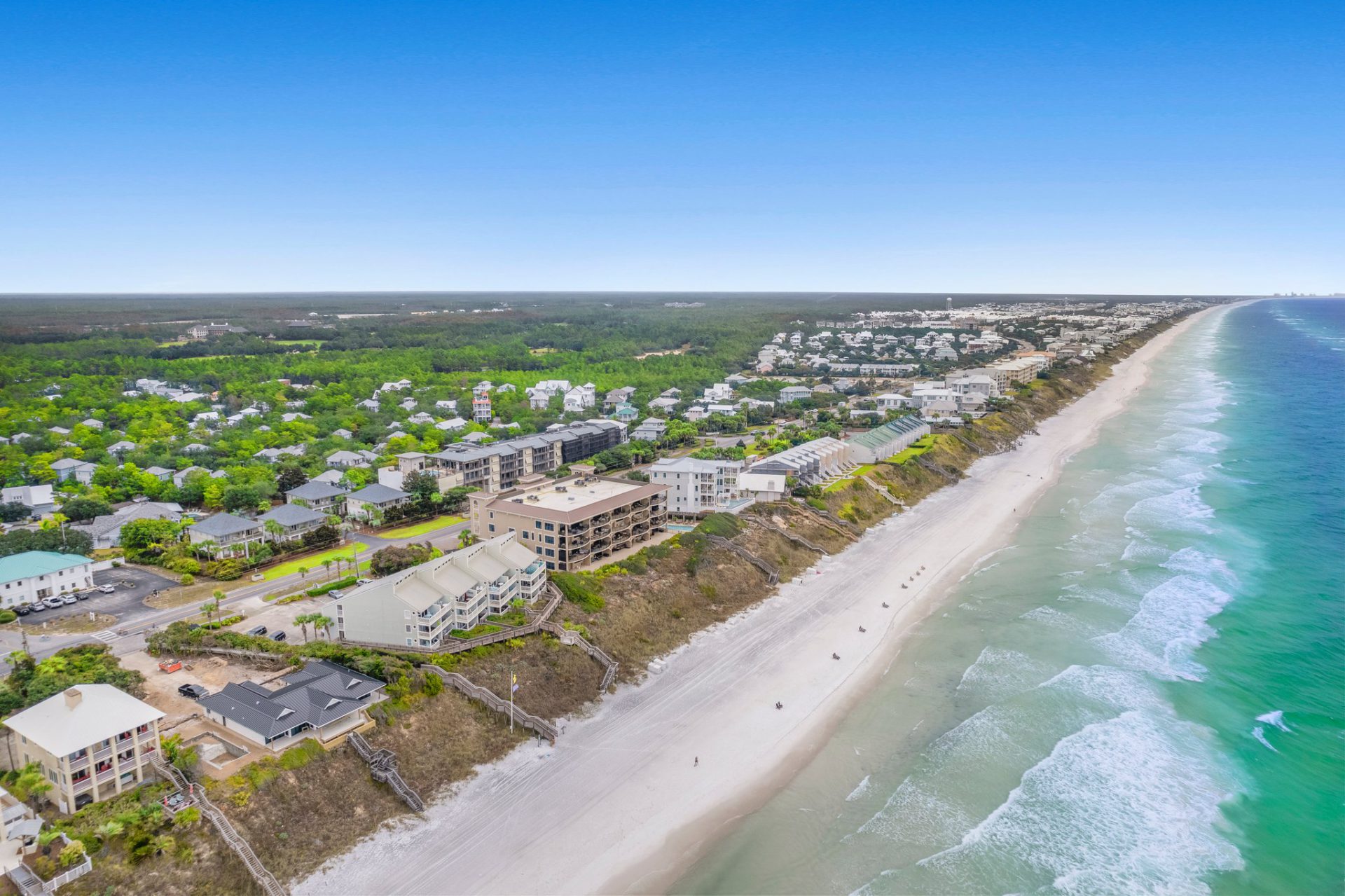 Aerial view of 30A coastline with beachfront properties along the Emerald Coast
